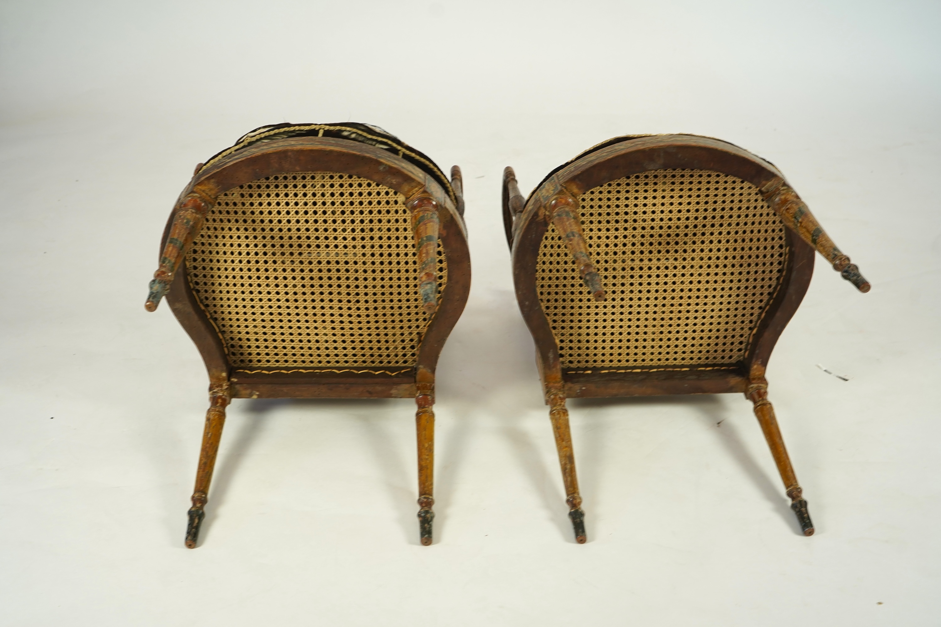 A set of six Sheraton period painted decorated cane seat elbow chairs